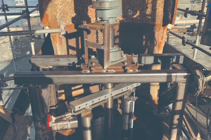 Mobile boring rig machining a rudder on site in dry dock