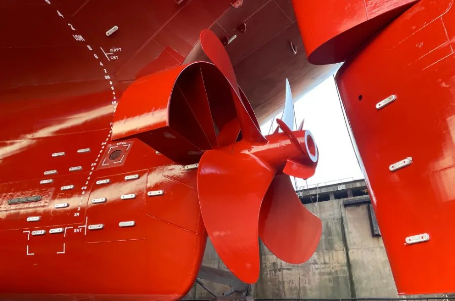 Completed installation of a ducted propeller on a red hull